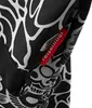 A close-up view of a red tag with the brand name 'reisenthel' on a black and white patterned fabric. Podgląd zdjęcia produktu