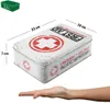 A first aid kit tin with dimensions shown, and a hand beneath it. Podgląd zdjęcia produktu