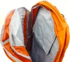 Close-up view of the interior of an open orange backpack. Voir les images du produit