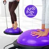 Two people using purple balance trainers with resistance bands. Náhled obrázku produktu