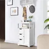 A white cabinet with drawers and a door is displayed against a white wall. Produktbild-Vorschau