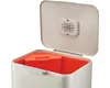 A close-up view of an open trash can with an orange inner bin. Podgląd zdjęcia produktu