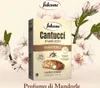 A box of Falcone Cantucci Mandorle almond cookies is displayed prominently, surrounded by decorative almond blossoms and leaves. Voir les images du produit