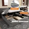 A bed with its storage compartments open, showing items stored inside. Anteprima dell’immagine prodotto