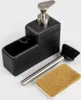 A black dish soap dispenser with a silver pump and a sponge and brush next to it, all on a white background. Produktbild-Vorschau