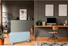 A modern living room or office space with a desk, computer, and a glass heater. Produktbild-Vorschau