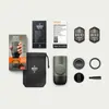 A flat lay of a Wacaco Minipresso GR2 portable espresso machine and its accessories, including packaging, a storage bag, and instruction manuals. Produktbild-Vorschau