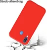 A red phone case is shown falling onto a cracked white surface, implying shock absorption. Anteprima dell’immagine prodotto