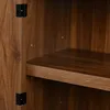 Close-up view of the interior of a wooden cabinet, showing a shelf and hinges. Anteprima dell’immagine prodotto