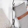 Close-up of kitchen items hanging on a hook. Produktbild-Vorschau