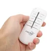 A hand holding a white remote control with buttons labeled A/B, C/D, ON, and OFF. Náhľad obrázku produktu