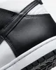 A close-up view of the side and sole of a black and white sneaker. Náhled obrázku produktu