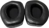 Two black ear pads for headphones are shown against a white background. Voir les images du produit