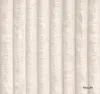 A close-up view of a textured fabric with vertical ribbed patterns. Podgląd zdjęcia produktu