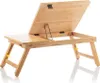 A wooden laptop table with adjustable legs and an angled top, shown against a white background. Produktbild-Vorschau