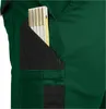 A close-up view of a green work pant pocket with a folding ruler inserted. Produktbild-Vorschau