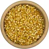 A close-up, top-down view of popcorn kernels in a wooden bowl. Náhľad obrázku produktu