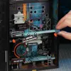 A hand is shown interacting with a detailed 3D model of a futuristic city scene, possibly a marble run or puzzle. Produktbild-Vorschau