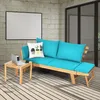 A wooden outdoor sofa with blue cushions is set up on a wooden deck next to a small wooden table with a laptop and a mug. Anteprima dell’immagine prodotto