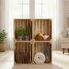 Four wooden crates stacked in a living room setting, decorated with plants, books, fruit, and a blanket. Náhled obrázku produktu