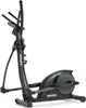 A black elliptical cross trainer with green accents, shown from a side-diagonal angle against a white background. Podgląd zdjęcia produktu