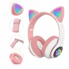 A pair of pink cat-ear headphones with RGB lighting. Náhľad obrázku produktu