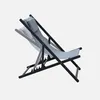 A gray sling chair is shown from a side angle against a light gray background. Anteprima dell’immagine prodotto