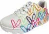 A white sneaker with colorful heart designs. Voir les images du produit