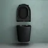 A black wall-mounted toilet with the seat open, shown against a teal wall and a concrete floor. Produktbild-Vorschau