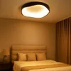 A bedroom scene with a bed and a ceiling light. Produktbild-Vorschau