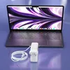 A laptop computer is shown connected to a white power adapter and cable. Podgląd zdjęcia produktu