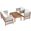 A wooden outdoor furniture set with white cushions and rope detailing, including a sofa, two chairs, and a coffee table, displayed on a white background. Produktbild-Vorschau
