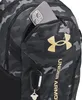 A close-up view of a backpack pocket with a phone inserted. Náhled obrázku produktu