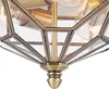 Close-up view of a brass-colored light fixture with glass panels. Anteprima dell’immagine prodotto