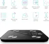 A black digital scale with silver accents is shown from a low angle, with a graphic overlay detailing its features. Produktbild-Vorschau