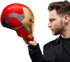 A man holds an Iron Man helmet in front of his face. Podgląd zdjęcia produktu