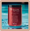 A red bottle of Fanola Botugen Reconstructive Mask is shown in front of a blue, watery background. Anteprima dell’immagine prodotto