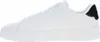 A side view of a white sneaker with a black heel accent. Voir les images du produit