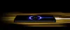 A smartphone is charging with a glowing charging animation on its screen, set against a background of blurred yellow light streaks. Produktbild-Vorschau