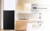 A kitchen scene with a black refrigerator and cabinetry, featuring product specifications overlaid on the image. Produktbild-Vorschau