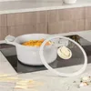 A pot of food on a stovetop. Náhľad obrázku produktu
