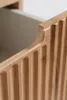 A close-up shot of the fluted wooden front of a cabinet or drawer. Produktbild-Vorschau