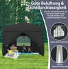 A black gazebo tent set up on a grassy lawn with two children inside, a picnic basket and blanket in front. Text overlays describe features. Produktbild-Vorschau