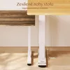 Close-up of a white adjustable desk leg next to a wooden desk leg, showing height adjustment and stability. Náhled obrázku produktu