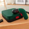 A Bosch Ixo 6 Classic electric screwdriver and its case are placed on a wooden surface. Produktbild-Vorschau