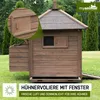 A wooden chicken coop with a run, set up on a grassy lawn with trees in the background. Produktbild-Vorschau