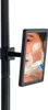 A close-up of a mirror reflecting a man shaving. Produktbild-Vorschau