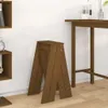A wooden stool is placed on a wooden floor next to a wooden table and a wooden shelf unit. Podgląd zdjęcia produktu