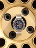 A Casio Edifice watch is placed on a gold-colored wheel rim. Náhled obrázku produktu