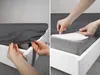 Two images showing how to put a fitted sheet on a mattress. Produktbild-Vorschau